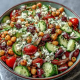 Mediterranean Chickpea Salad with bright lemon dressing and fresh herbs is vibrant.
