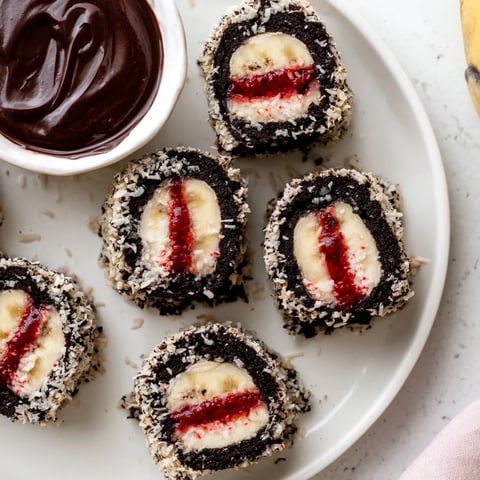 Oreo Cookie Sushi Rolls with chocolate dip, arranged for serving, showcasing the dessert's delicious appearance.