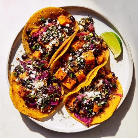 These easy Quick Sweet Potato and Black Bean Tacos feature roasted sweet potatoes and flavorful, well-seasoned black beans.