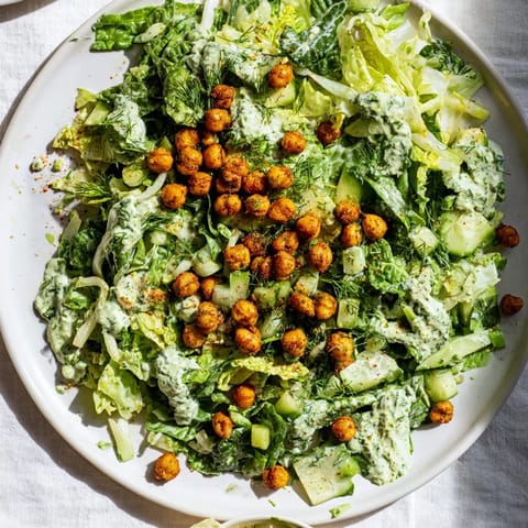 Fresh Green Goddess Salad showcasing bright green veggies and crunchy air-fried chickpea topping for a tasty lunch.