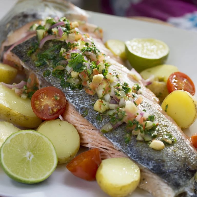 Sizzling One-Tray Baked Trout arrives, showcasing perfectly cooked fish with garlic and fresh herbs.